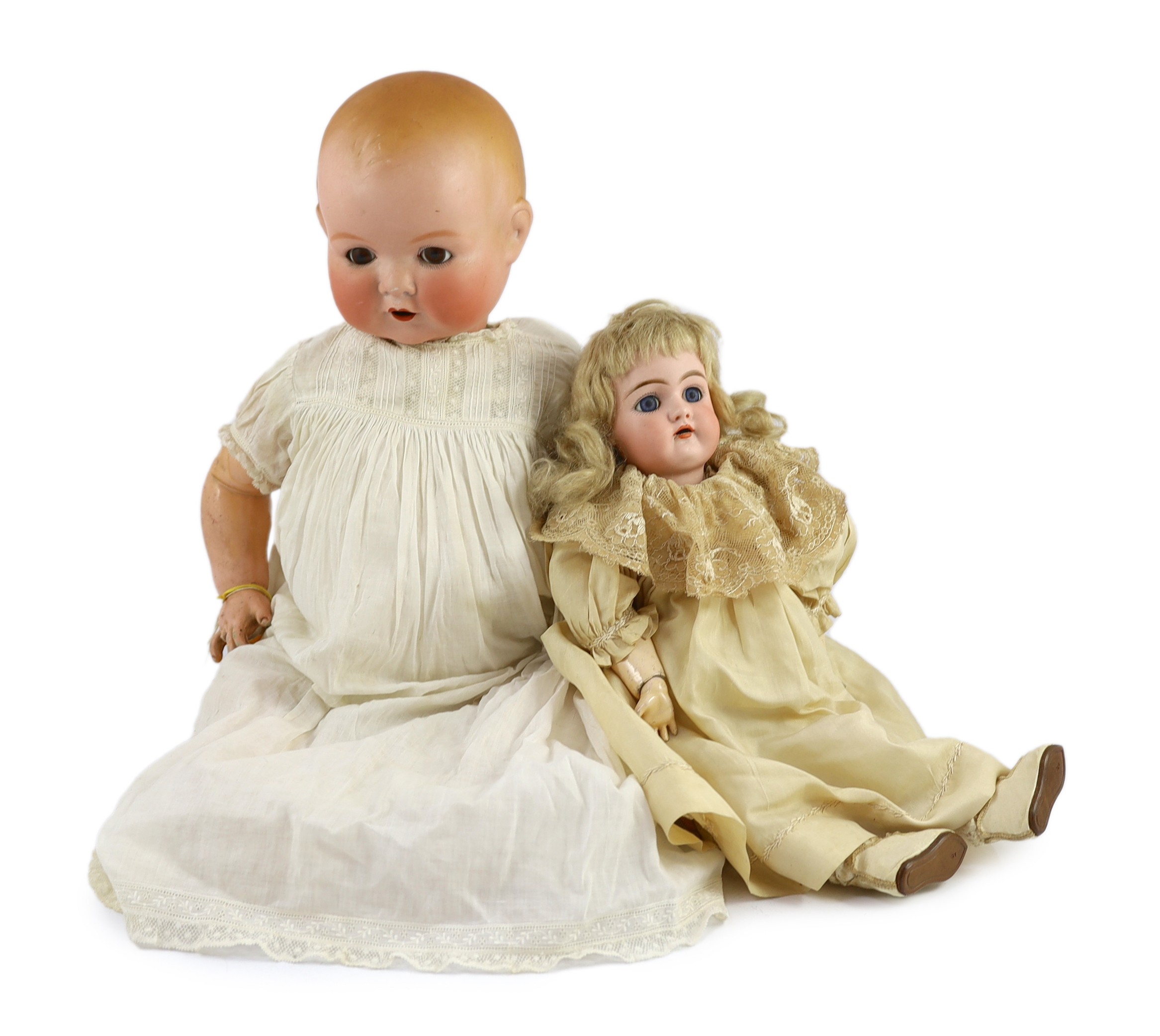 A Heinrich Handwerck bisque doll, German, circa 1900, 18in. and 23in. resp.